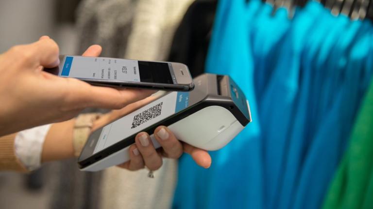 Carbon Mobile 5 and smart phone showing alternative payment transaction