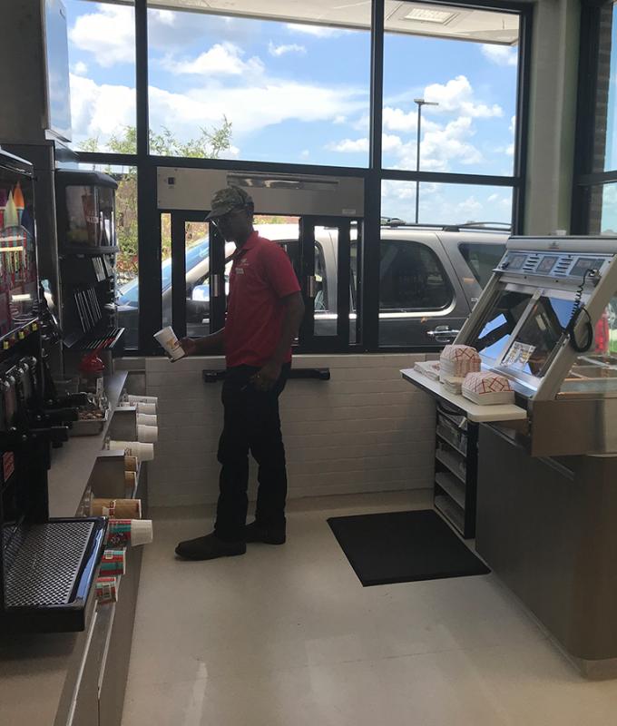 Drive-thru employee cashing out order