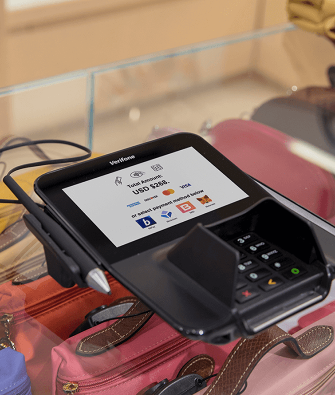 M400 device sitting on a counter ready to accept crypto payments