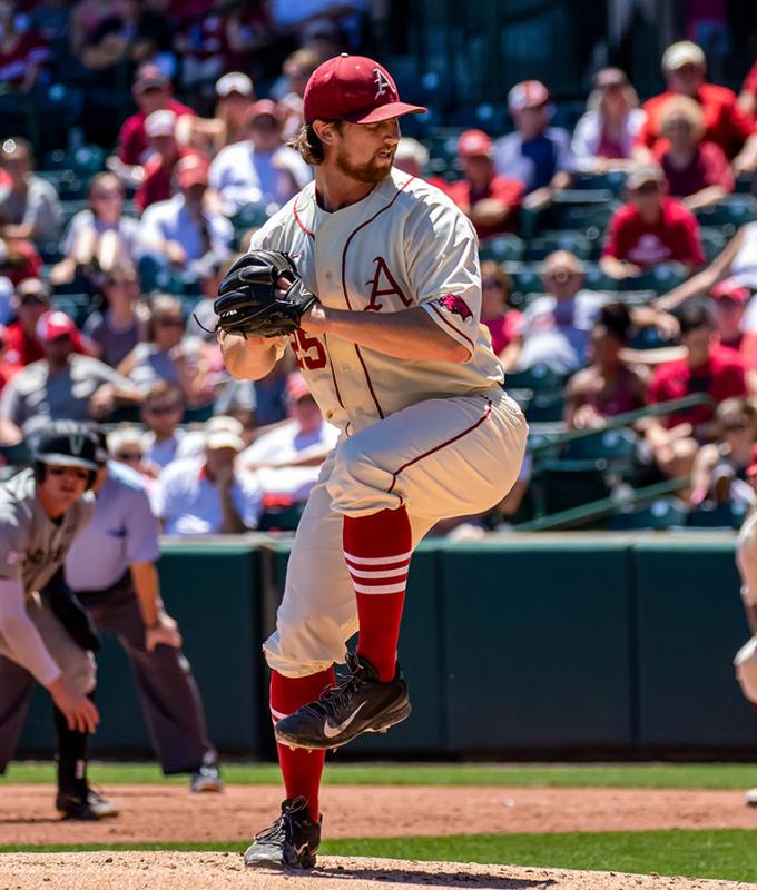 image_baseball pitcher getting ready to throw the ball