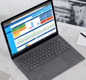 Logged into the Verifone Back Office solution on a laptop at a workstation